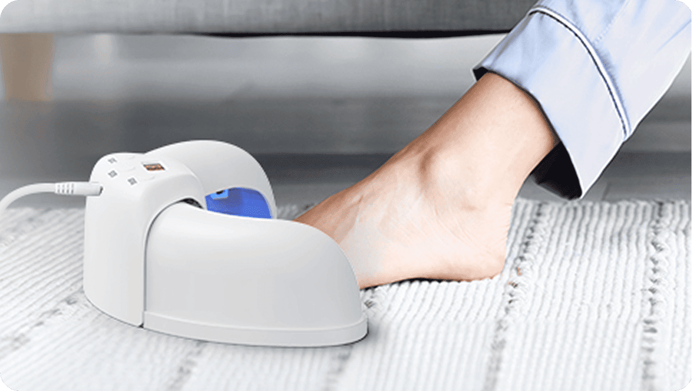 FungaBeam device being used as part of an at-home nail care routine